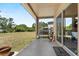 Inviting patio with outdoor seating area, barbecue grill, and views of the backyard at 524 Nogales, Kissimmee, FL 34758