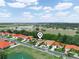 Aerial view of a residential area featuring well-maintained homes, lush greenery, and neighborhood streets at 530 Greenway Dr, Lake Wales, FL 33898