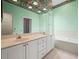 Bathroom features double sinks, a soaking tub, and unique floral ceiling decor at 530 Greenway Dr, Lake Wales, FL 33898