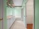 Bathroom featuring double vanity sinks, a soaking tub, and a walk-in closet at 530 Greenway Dr, Lake Wales, FL 33898