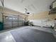 View of the home's empty two car garage with workbench at 530 Greenway Dr, Lake Wales, FL 33898