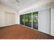 An empty sun room with wood floors and sliding glass doors to the exterior at 530 Greenway Dr, Lake Wales, FL 33898