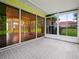 Enclosed sun room with brick floors and sliding glass doors at 530 Greenway Dr, Lake Wales, FL 33898