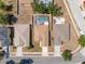 An aerial view showcases the fenced backyard with a screened pool and lanai, providing a private outdoor oasis at 533 Ronshelle Ave, Haines City, FL 33844