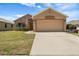 Charming single-story home featuring a spacious two-car garage, well-maintained lawn, and inviting curb appeal at 533 Ronshelle Ave, Haines City, FL 33844
