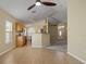 Bright kitchen with granite countertops, stainless steel appliances, and an open layout to living room at 533 Ronshelle Ave, Haines City, FL 33844