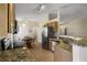 Well-appointed kitchen featuring granite countertops, stainless steel appliances, and tile flooring at 533 Ronshelle Ave, Haines City, FL 33844