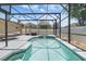 Backyard pool with spa in screened enclosure, providing a private outdoor oasis at 533 Ronshelle Ave, Haines City, FL 33844