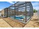 Backyard pool with full screened enclosure and rock landscaping for a private retreat at 533 Ronshelle Ave, Haines City, FL 33844