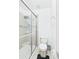This bathroom features a glass shower enclosure and modern fixtures at 5787 Dornich Dr, Auburndale, FL 33823