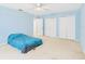 Spacious bedroom featuring a ceiling fan, light blue walls and carpeted flooring at 5787 Dornich Dr, Auburndale, FL 33823