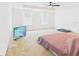 A spacious main bedroom with carpet and a ceiling fan for added comfort at 5787 Dornich Dr, Auburndale, FL 33823