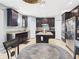 Spacious kitchen boasting dark wood cabinets, stainless steel appliances, and a central island at 5787 Dornich Dr, Auburndale, FL 33823