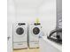 Modern laundry room features front-load washer and dryer set at 5787 Dornich Dr, Auburndale, FL 33823