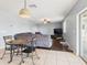 Bright living room with tile and hardwood flooring and a view to a grey sectional sofa at 5787 Dornich Dr, Auburndale, FL 33823