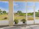 A view from the enclosed patio shows the natural landscape at 5787 Dornich Dr, Auburndale, FL 33823