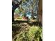 Backyard featuring mature trees and shrubs at 620 Se Oleander Se Dr, Winter Haven, FL 33880