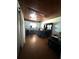 The bedroom has wood paneled walls, a ceiling fan, and a small window at 620 Se Oleander Se Dr, Winter Haven, FL 33880