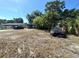 This single-story home has a driveway and mature trees at 620 Se Oleander Se Dr, Winter Haven, FL 33880