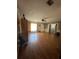 The living room offers wood laminate flooring, a ceiling fan, and natural light at 620 Se Oleander Se Dr, Winter Haven, FL 33880