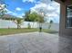 Tile patio and fenced backyard with landscaping and blue urn at 625 Disa Dr, Davenport, FL 33837