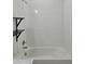 Bathroom featuring shelves and bathtub at 625 Disa Dr, Davenport, FL 33837