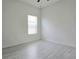 Bedroom featuring light, neutral walls and flooring and window at 625 Disa Dr, Davenport, FL 33837