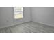 Bedroom featuring light, neutral colored walls and flooring and window at 625 Disa Dr, Davenport, FL 33837