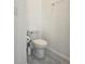 Close up of toilet and neutral colored walls at 625 Disa Dr, Davenport, FL 33837