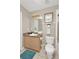 Neutral bathroom with vanity, toilet, and decorative accents at 662 Orista Dr, Davenport, FL 33897