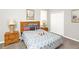 Comfortable bedroom with a queen-sized bed, bedside tables, and soft carpet flooring at 662 Orista Dr, Davenport, FL 33897