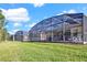 Spacious screened-in patio offering a relaxing outdoor living space with ample room for entertaining and enjoying views at 662 Orista Dr, Davenport, FL 33897