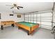 Garage game room featuring a pool table and a foosball table at 662 Orista Dr, Davenport, FL 33897