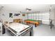 Garage featuring game room with an air hockey table and a pool table at 662 Orista Dr, Davenport, FL 33897