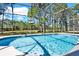 The pool features a step-down entry and is screened-in for bug protection at 662 Orista Dr, Davenport, FL 33897