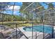 A view of the screened-in pool area shows the spacious backyard at 662 Orista Dr, Davenport, FL 33897