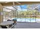 Pool area features a sitting area with a view of the pool and the backyard at 662 Orista Dr, Davenport, FL 33897