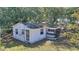 Aerial view of a single story home that features a screened front porch at 6925 3Rd St, Mulberry, FL 33860