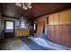 A rustic kitchen featuring wooden cabinets, sink, and a window at 6925 3Rd St, Mulberry, FL 33860