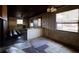 A living area showcasing a breakfast bar, windows, and access to other rooms at 6925 3Rd St, Mulberry, FL 33860