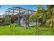 Enjoy this beautiful backyard with a screened-in pool, lush landscaping, and plenty of space to enjoy the sunshine at 716 Maderia Ct, Kissimmee, FL 34758