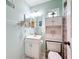 Bright bathroom featuring a white vanity, a lighted mirror, and a combined shower-tub at 716 Maderia Ct, Kissimmee, FL 34758