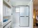 Bright bathroom featuring shower, glass door and white shelving for toiletries and accessories at 716 Maderia Ct, Kissimmee, FL 34758
