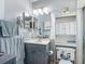 This bathroom features a vanity with modern fixtures and plenty of storage space for all your essentials at 716 Maderia Ct, Kissimmee, FL 34758
