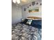 Comfortable bedroom with coastal themed decor above the bed at 716 Maderia Ct, Kissimmee, FL 34758