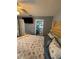 Comfortable bedroom showcasing an ensuite bathroom and a mounted television at 716 Maderia Ct, Kissimmee, FL 34758