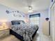 Comfortable bedroom featuring a ceiling fan and tiled flooring at 716 Maderia Ct, Kissimmee, FL 34758