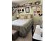 Bedroom showcasing unique decor, tiled floors, and a comfortable bed at 716 Maderia Ct, Kissimmee, FL 34758