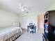 This cozy bedroom has tile flooring, a ceiling fan, and includes an office space for all your work needs at 716 Maderia Ct, Kissimmee, FL 34758
