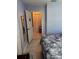 Bedroom featuring tiled floors and a view into a hall with closets at 716 Maderia Ct, Kissimmee, FL 34758